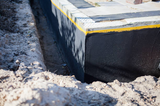 Professional Emergency Waterproofing technician working in Edmore, MI